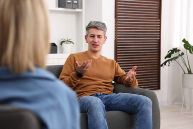 Photo of Professional psychologist working with patient in office