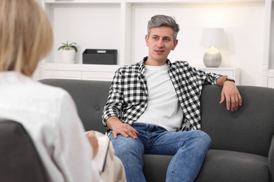 Photo of Professional psychologist working with patient in office