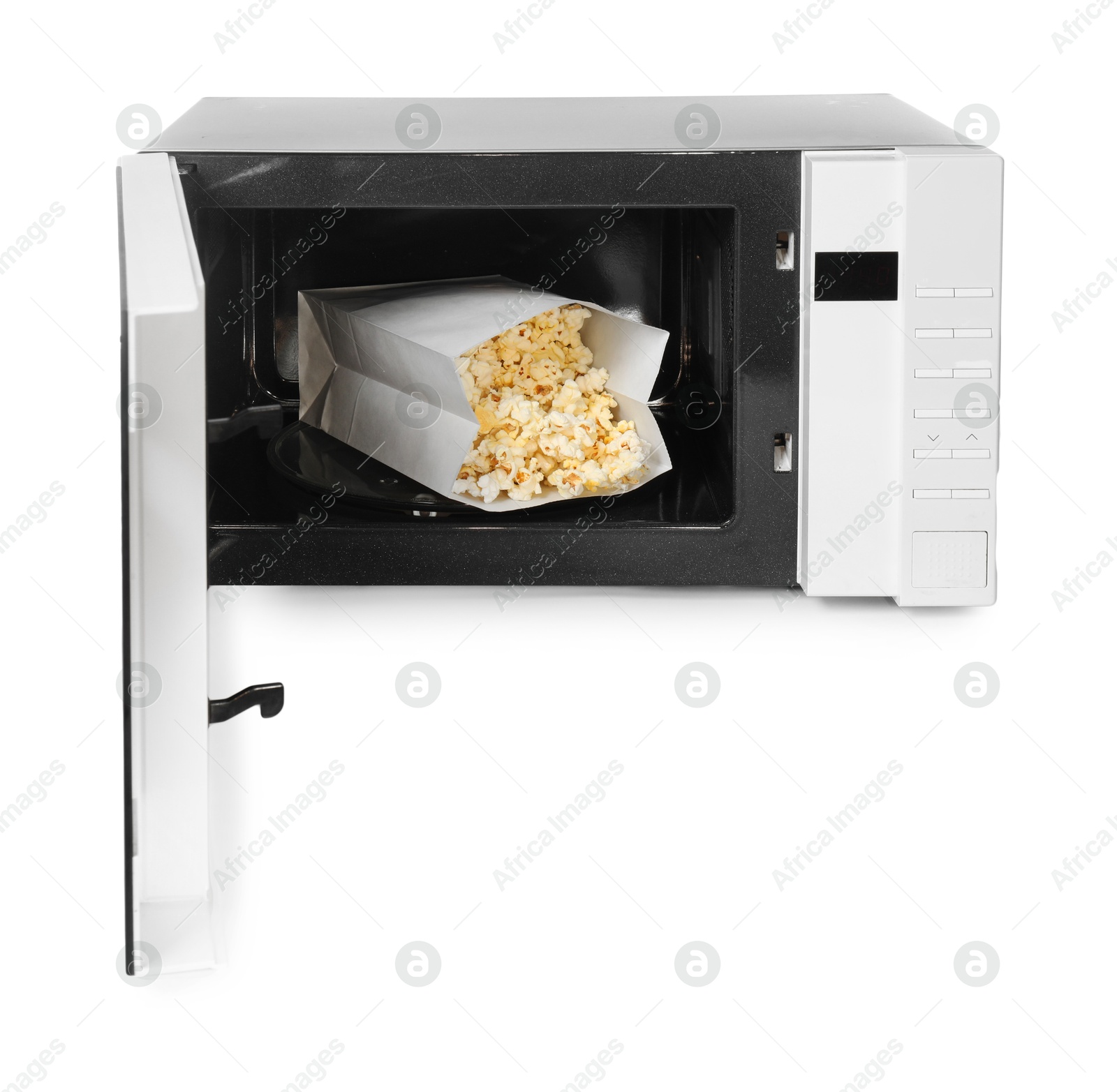 Photo of Open microwave oven with bag of popcorn isolated on white