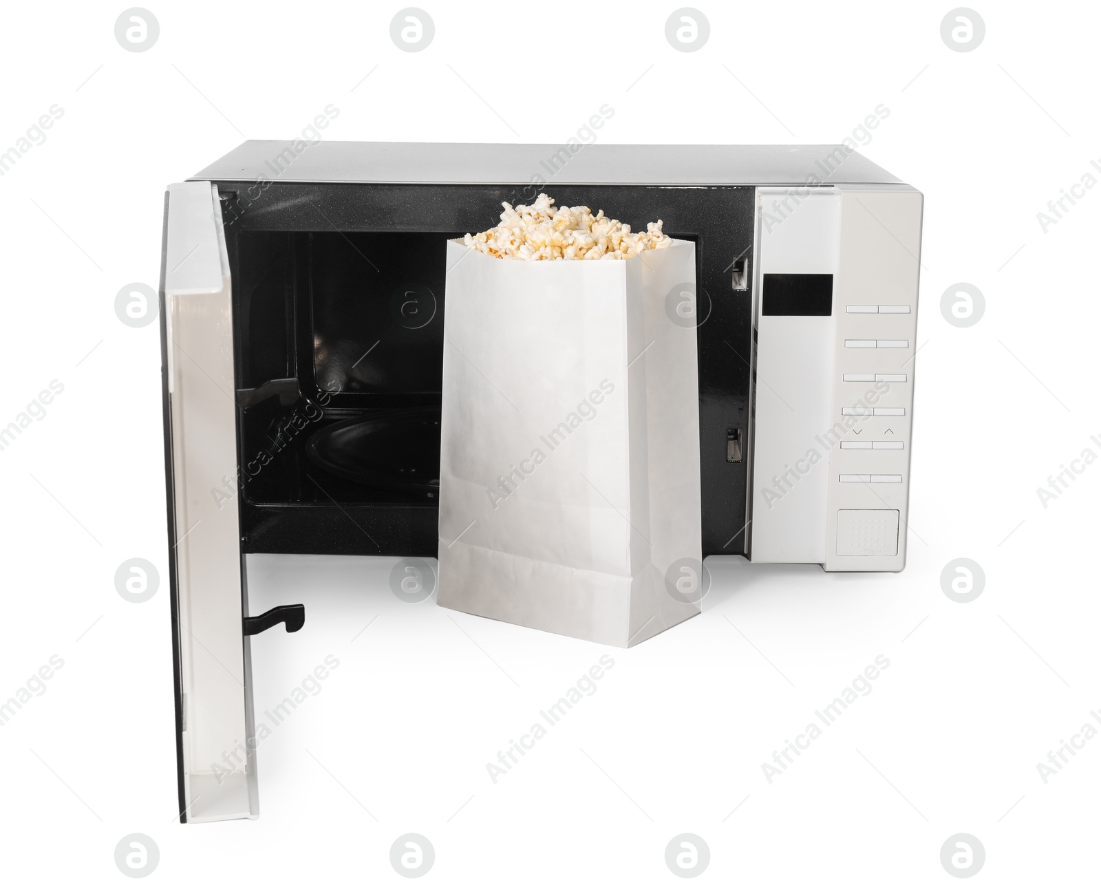 Photo of Bag of popcorn and open microwave oven isolated on white