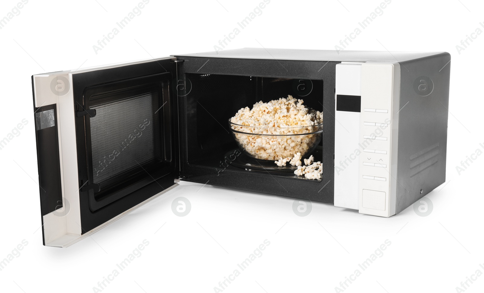 Photo of Open microwave oven with bowl of popcorn isolated on white