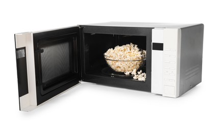 Photo of Open microwave oven with bowl of popcorn isolated on white