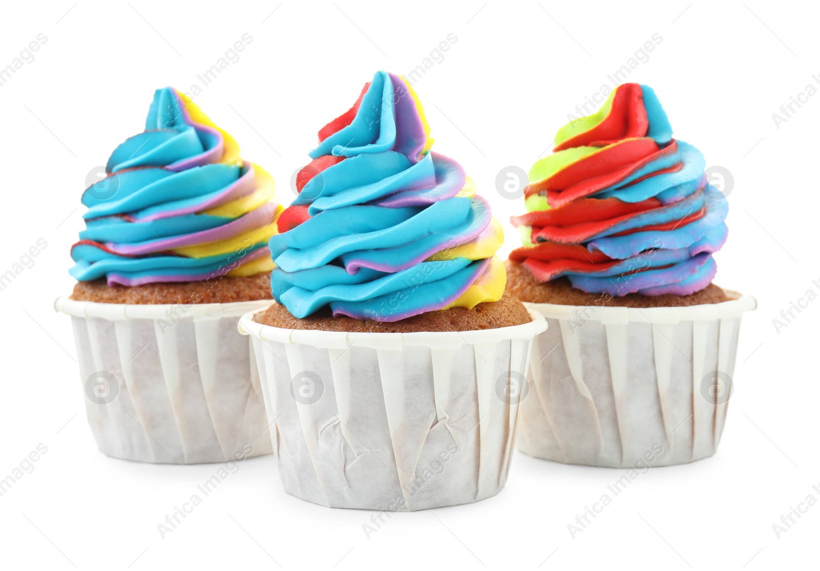 Photo of Tasty cupcakes with colorful cream isolated on white