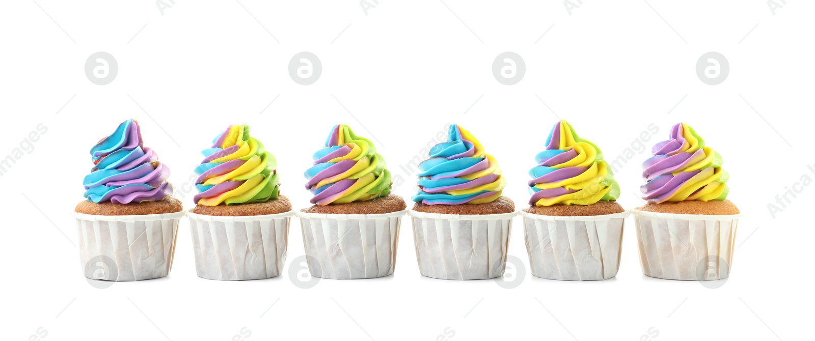 Photo of Tasty cupcakes with colorful cream isolated on white