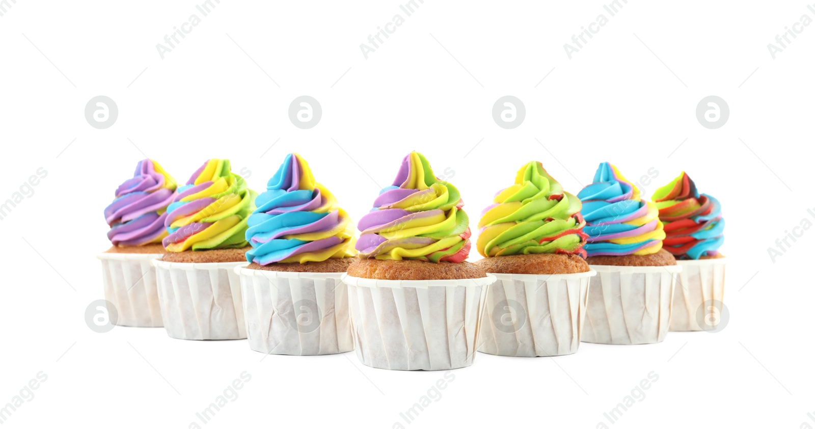 Photo of Tasty cupcakes with colorful cream isolated on white