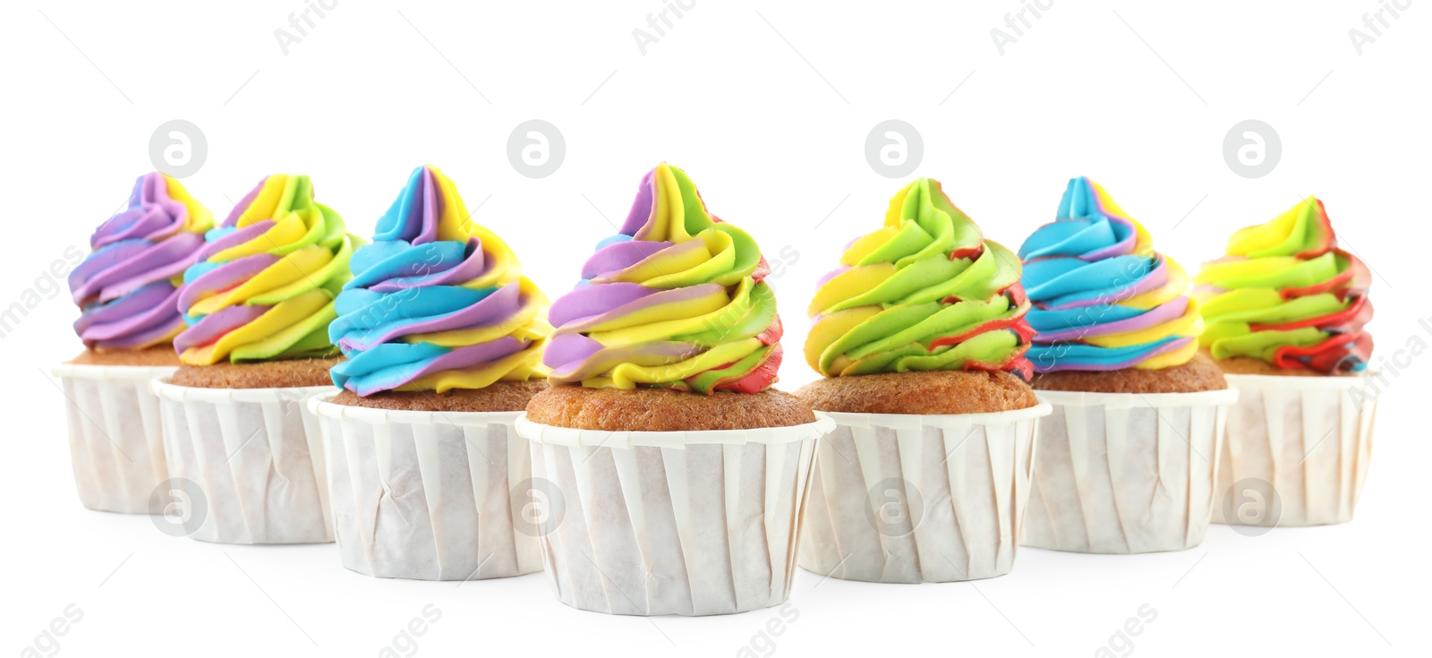 Photo of Tasty cupcakes with colorful cream isolated on white