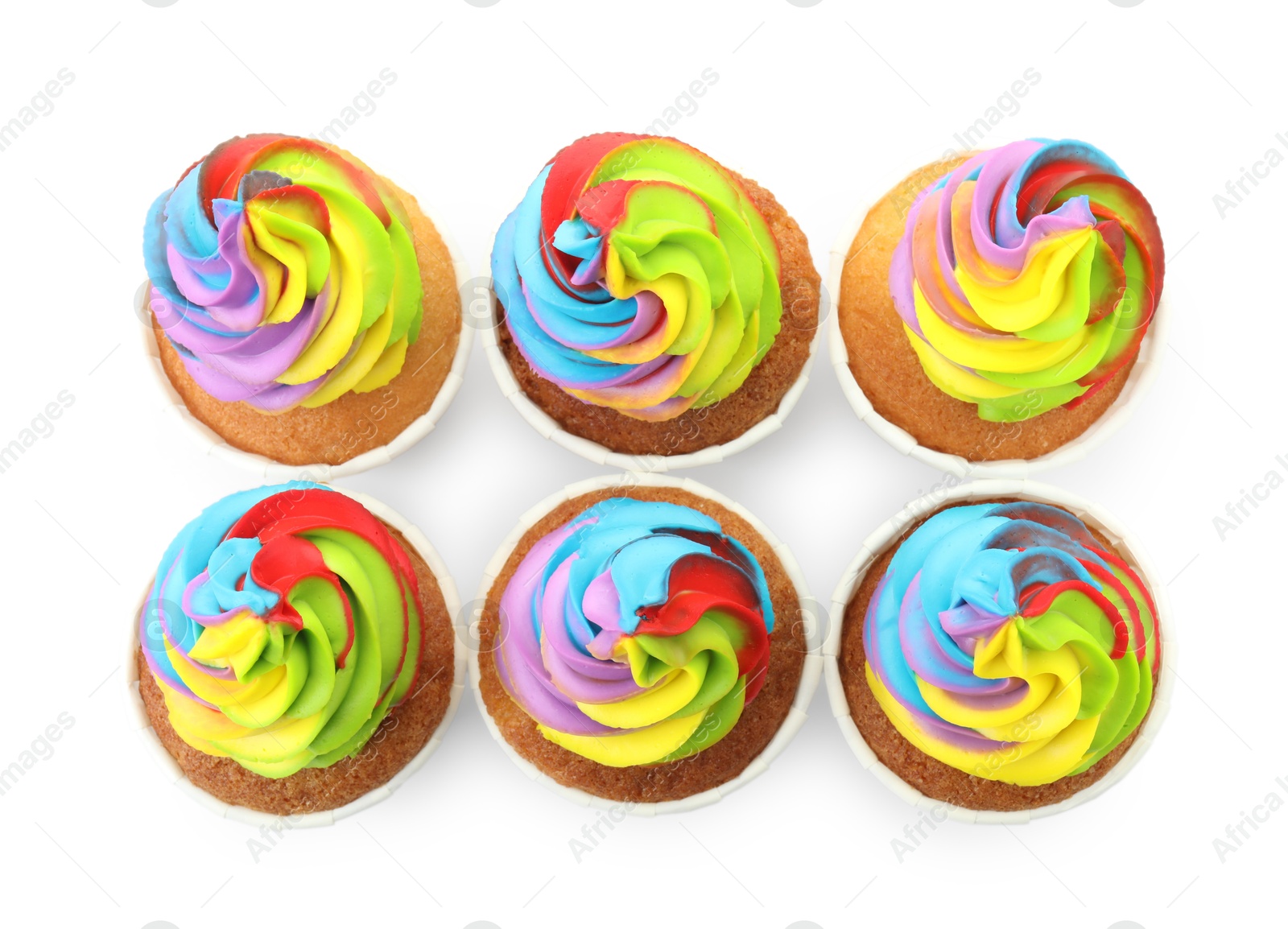 Photo of Tasty cupcakes with colorful cream isolated on white, top view