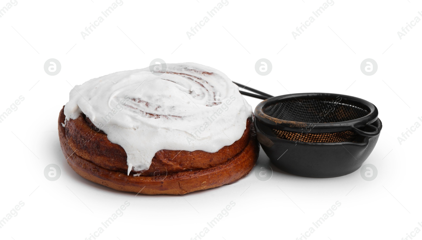 Photo of Tasty roll with cream and cinnamon isolated on white