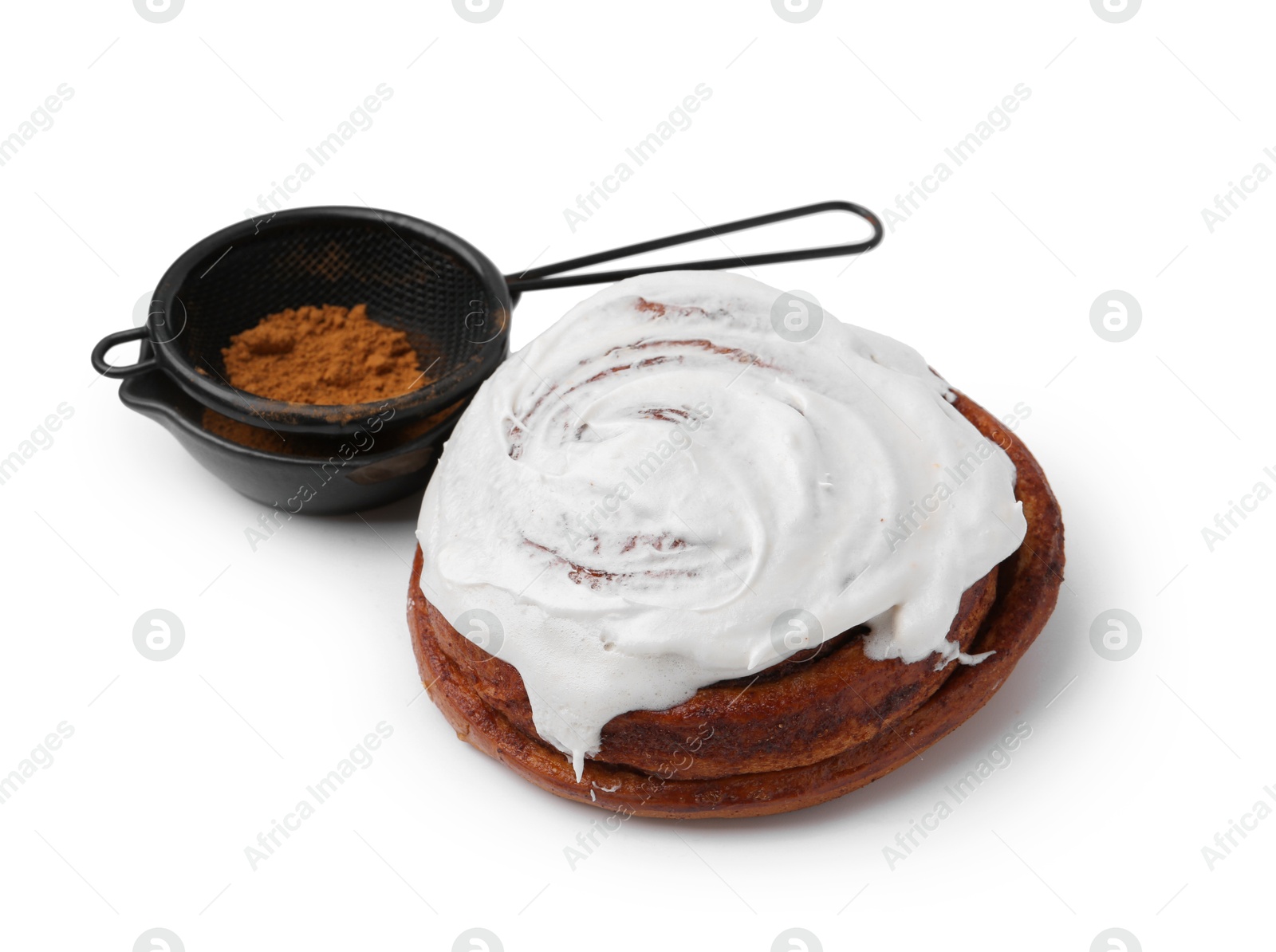 Photo of Tasty roll with cream and cinnamon isolated on white