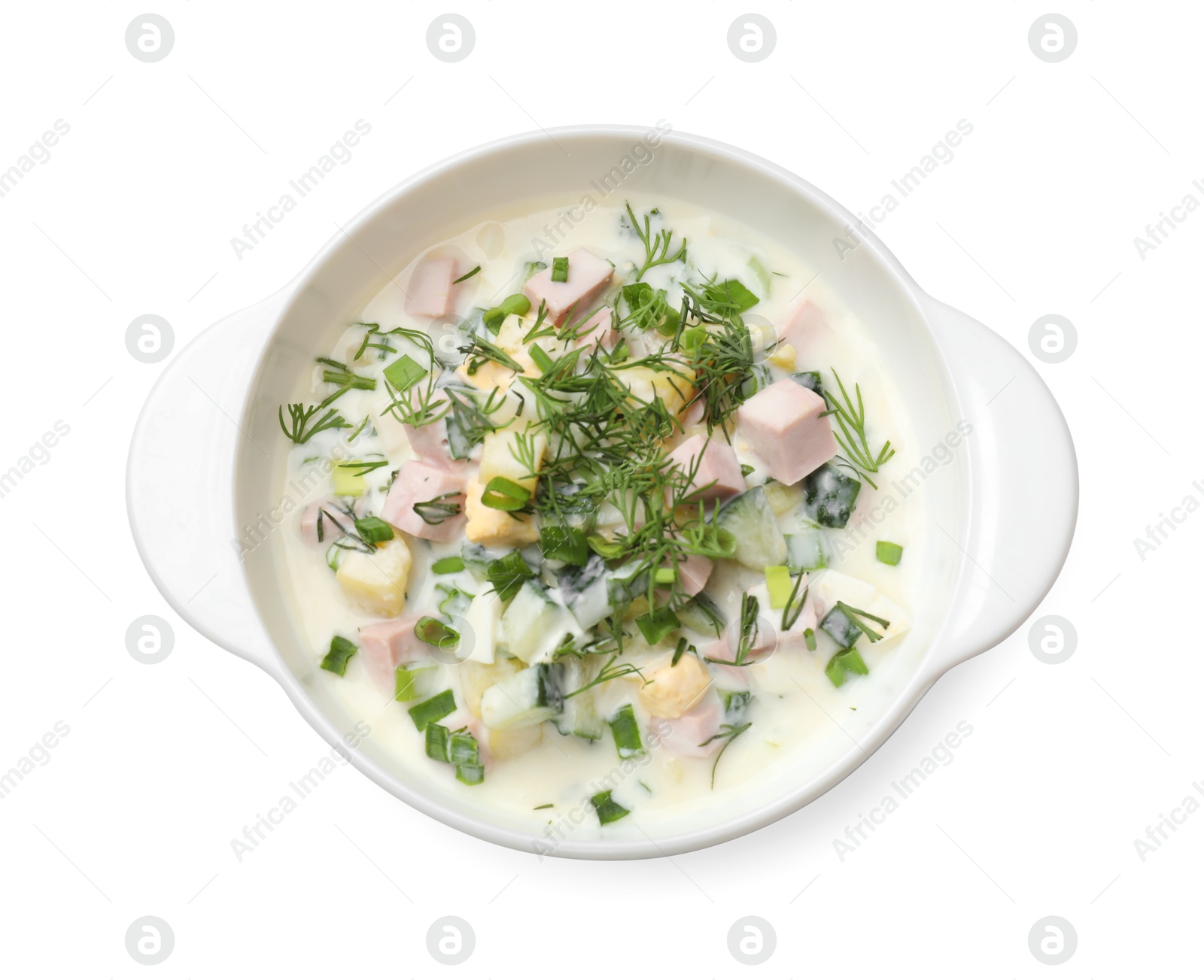 Photo of Delicious okroshka soup in bowl isolated on white, top view