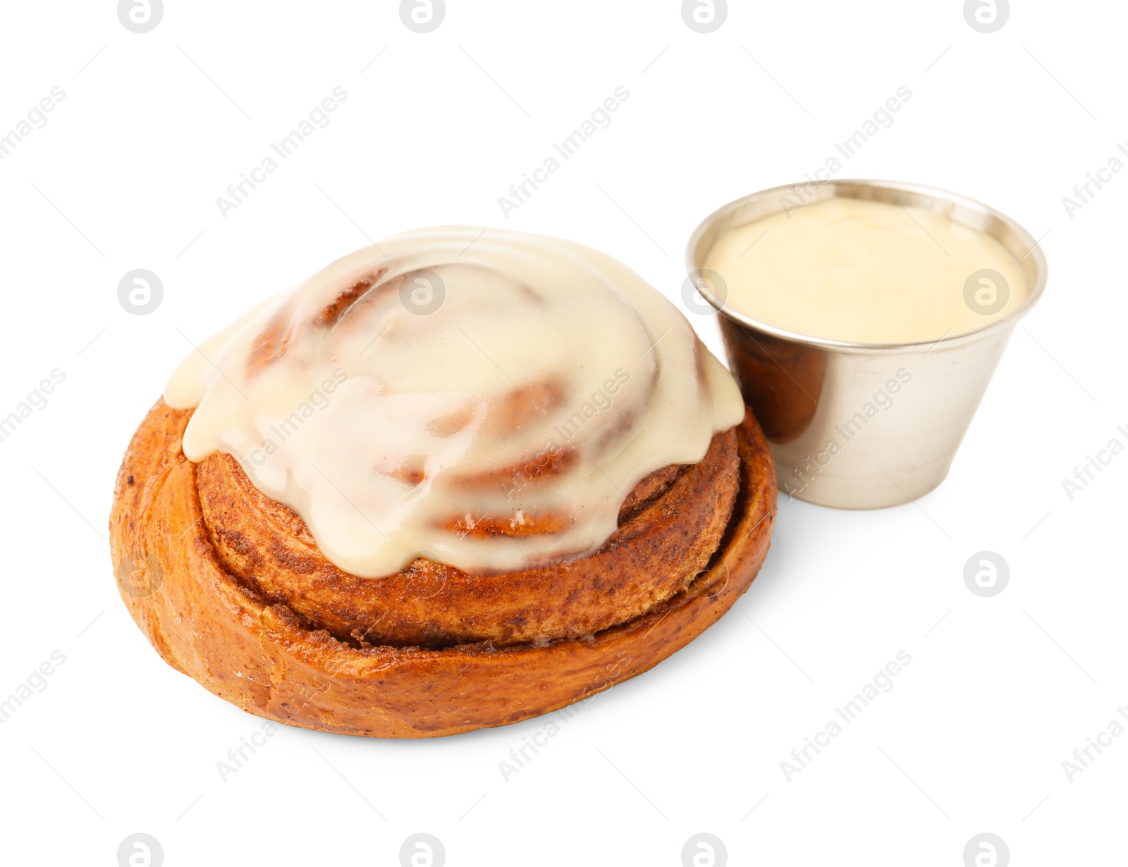 Photo of Tasty cinnamon roll with cream isolated on white