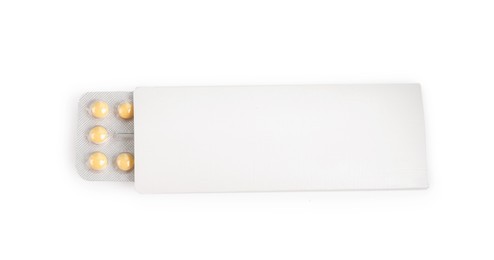 Photo of Blister of contraceptive pills in package isolated on white, top view. Mockup for design