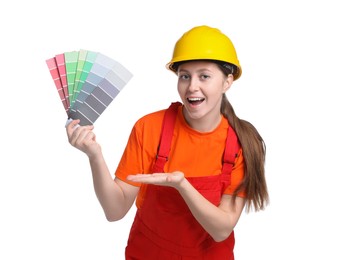 Photo of Professional painter with color selection chart on white background