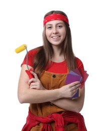 Photo of Woman with paint roller and color samples on white background