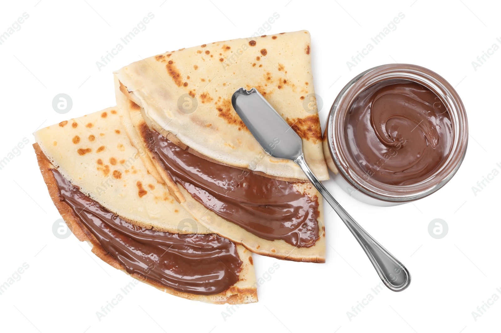 Photo of Tasty crepes with chocolate butter and knife isolated on white, top view