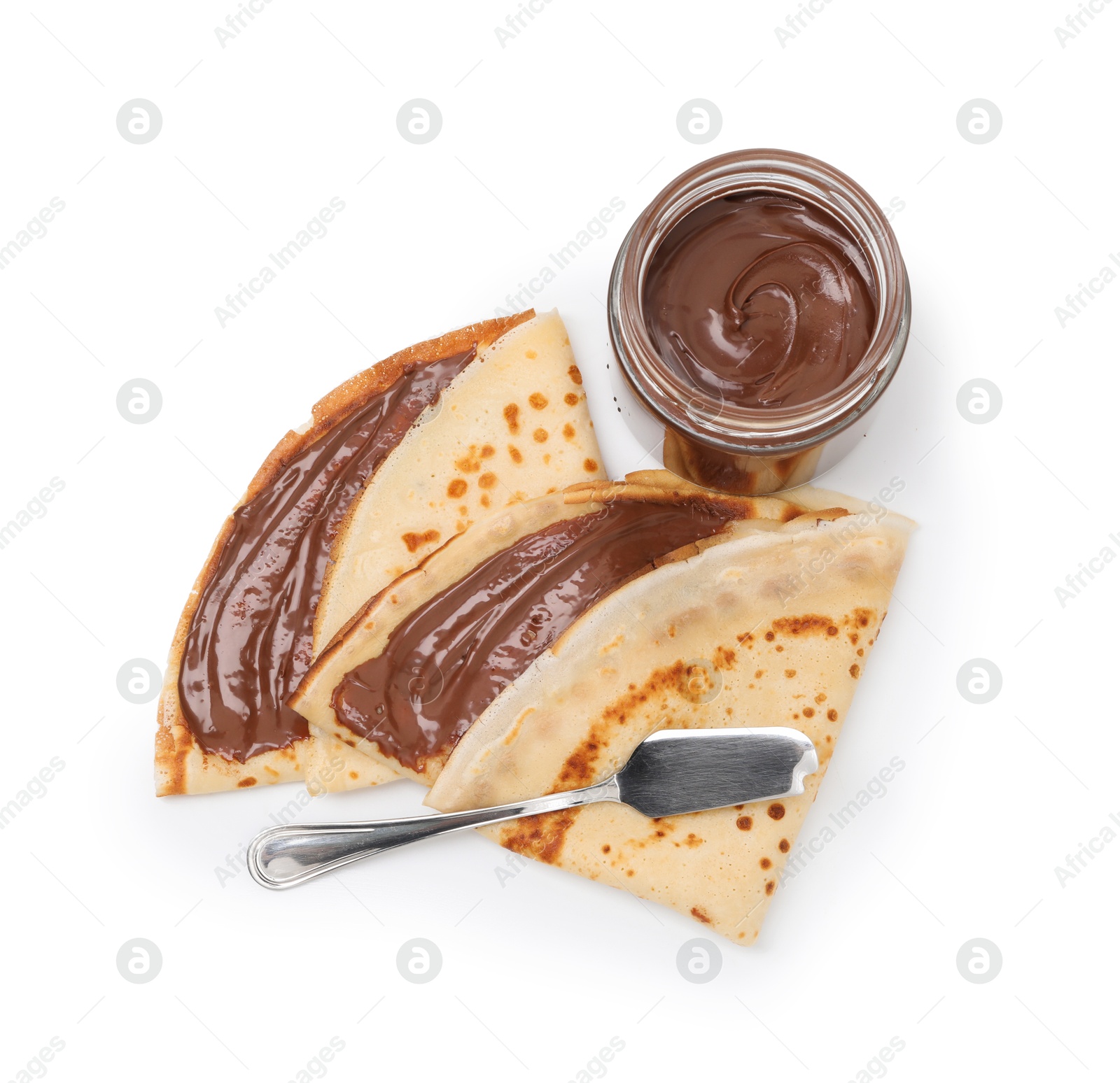 Photo of Tasty crepes with chocolate butter and knife isolated on white, top view