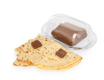 Photo of Tasty crepes with chocolate butter isolated on white