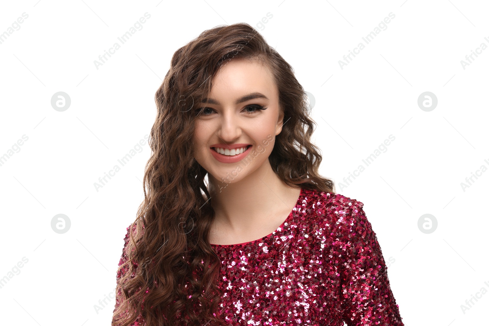 Photo of Beautiful young woman with long curly brown hair in pink sequin dress on white background