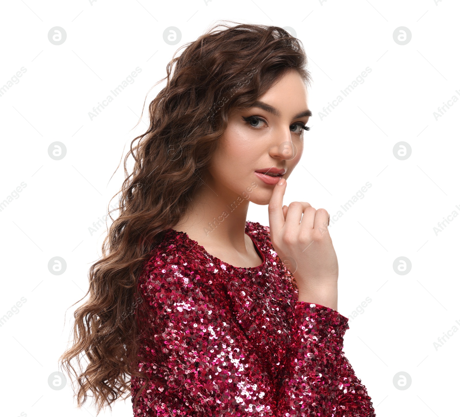 Photo of Beautiful young woman with long curly brown hair in pink sequin dress on white background