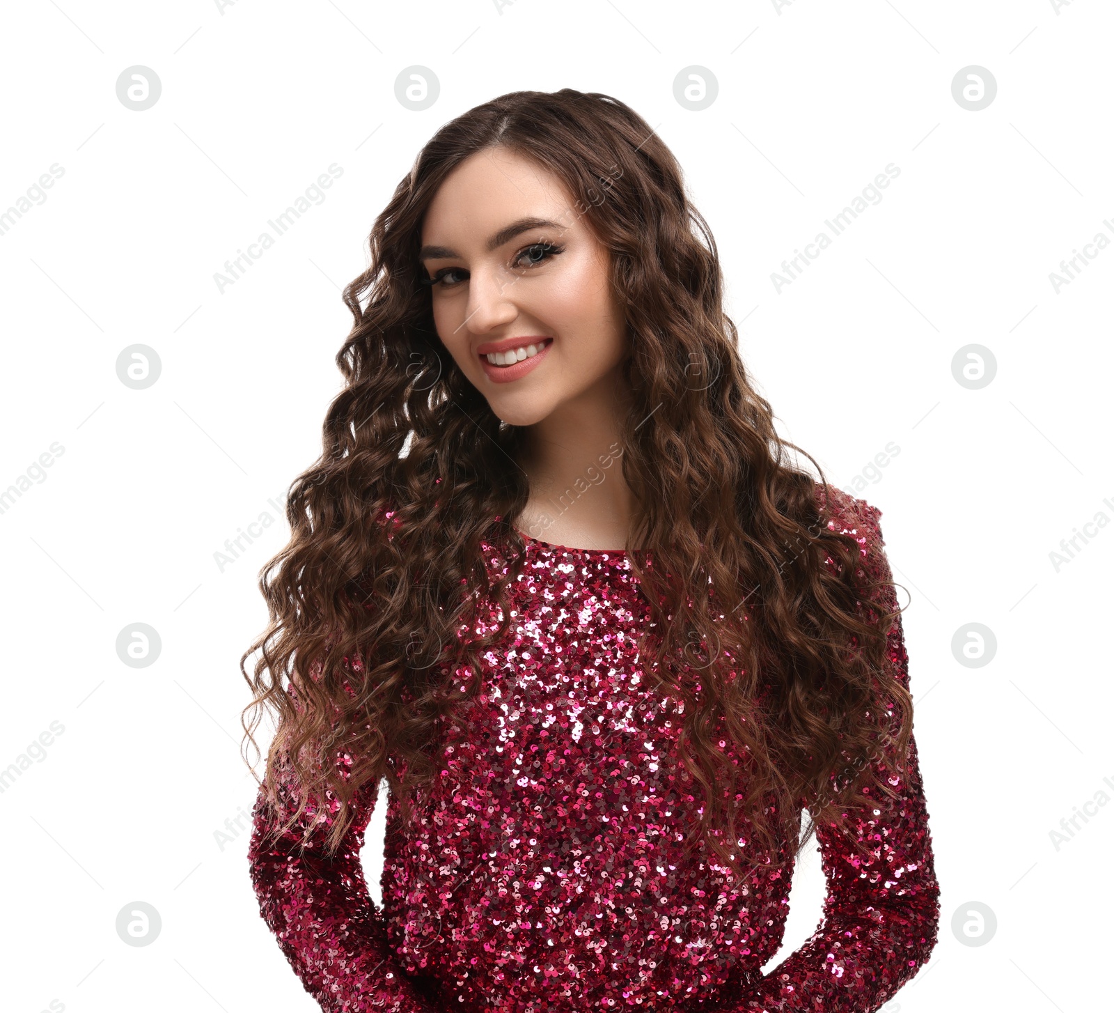 Photo of Beautiful young woman with long curly brown hair in pink sequin dress on white background