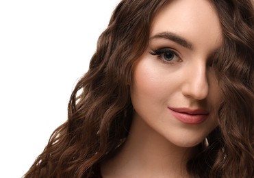 Photo of Beautiful young woman with long curly brown hair on white background, closeup