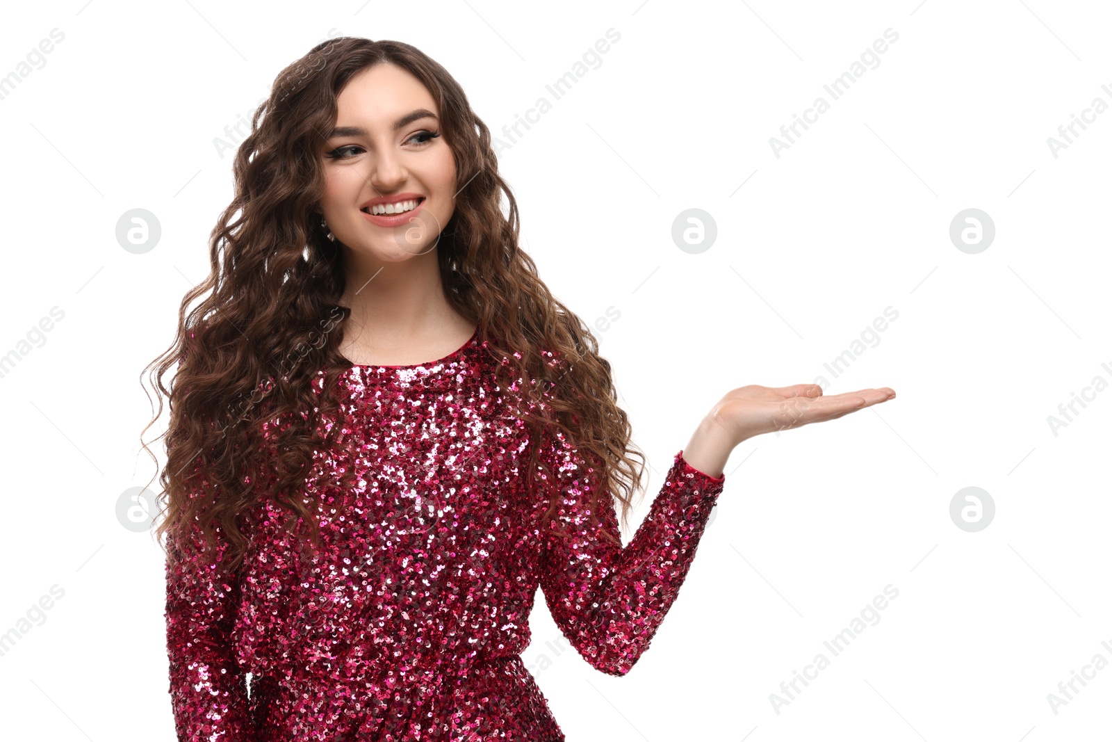 Photo of Beautiful young woman with long curly brown hair in pink sequin dress on white background