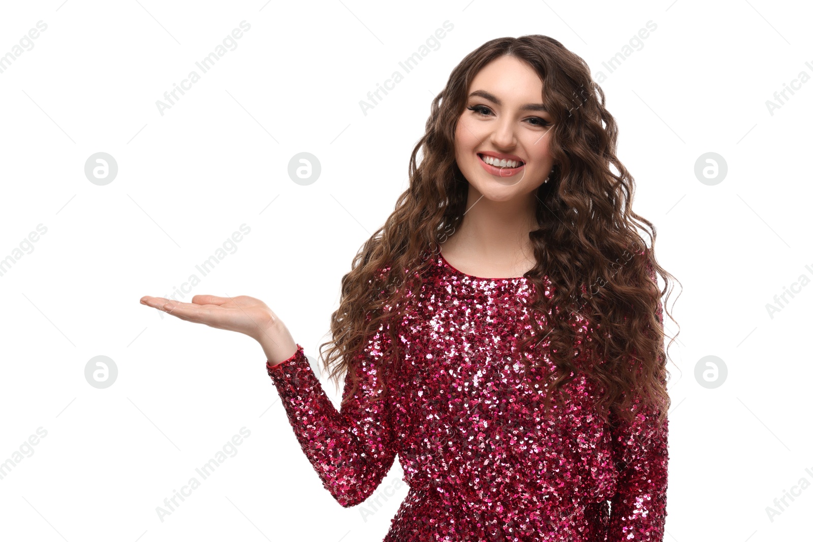 Photo of Beautiful young woman with long curly brown hair in pink sequin dress on white background