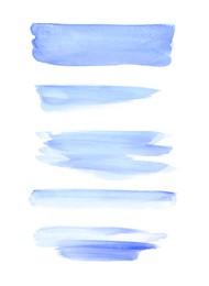 Photo of Light blue watercolor strokes on white background, top view