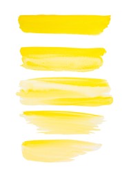 Photo of Yellow watercolor strokes on white background, top view