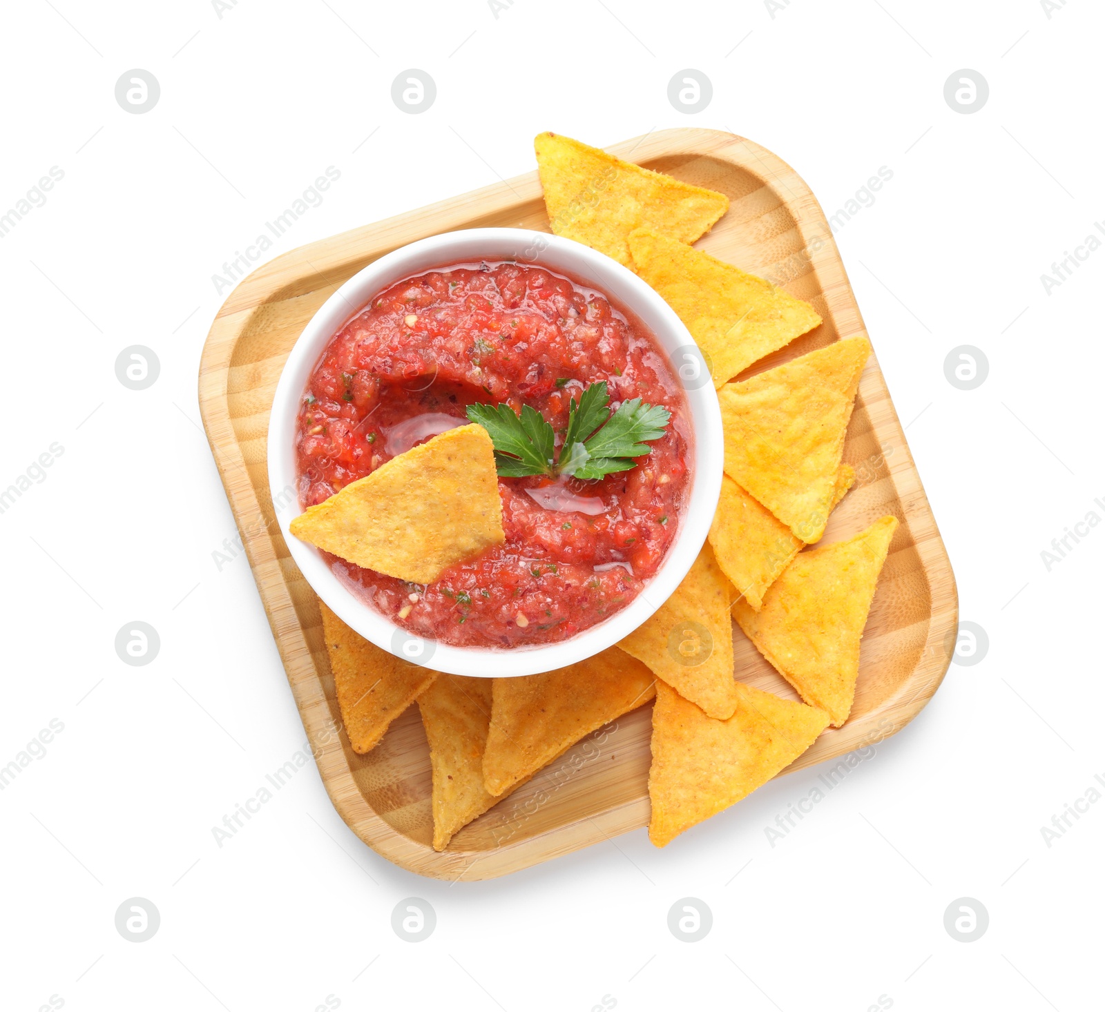 Photo of Delicious spicy salsa sauce in bowl and nacho chips isolated on white, top view