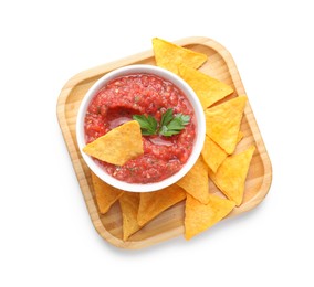 Photo of Delicious spicy salsa sauce in bowl and nacho chips isolated on white, top view