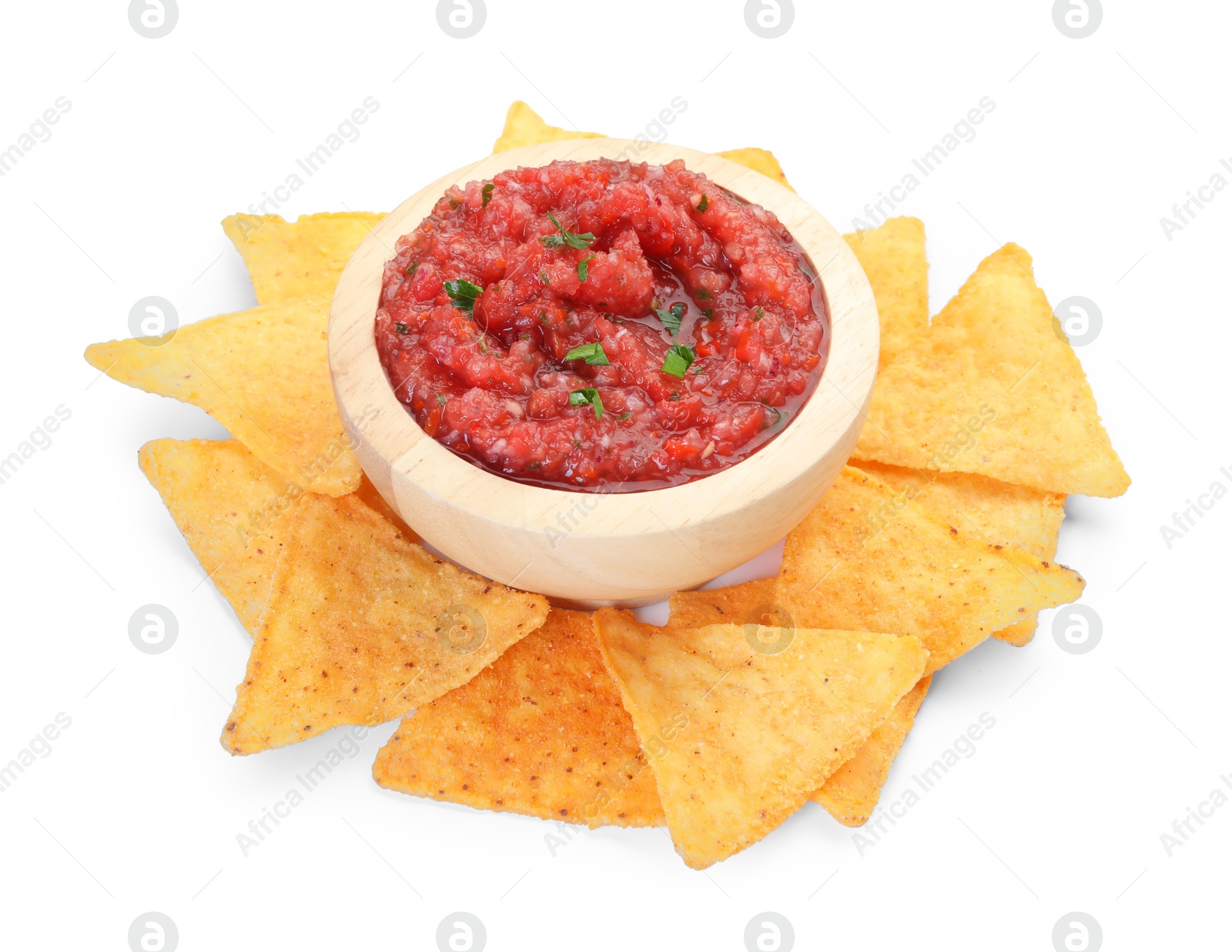 Photo of Spicy salsa sauce in bowl and nachos isolated on white