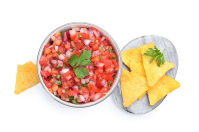 Photo of Delicious salsa in bowl and nacho chips isolated on white, top view