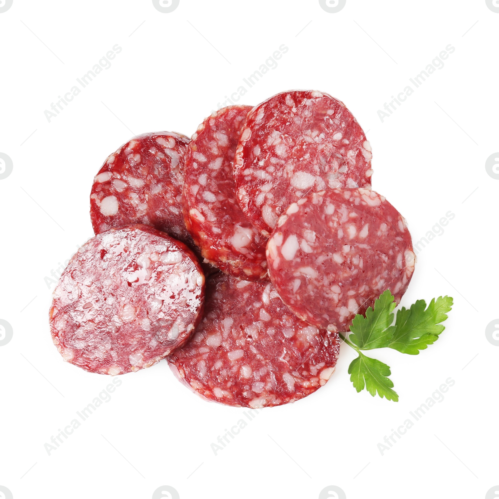 Photo of Pieces of delicious dry cured sausage and parsley isolated on white, top view