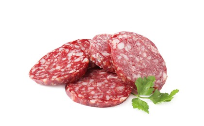 Photo of Pieces of delicious dry cured sausage and parsley isolated on white