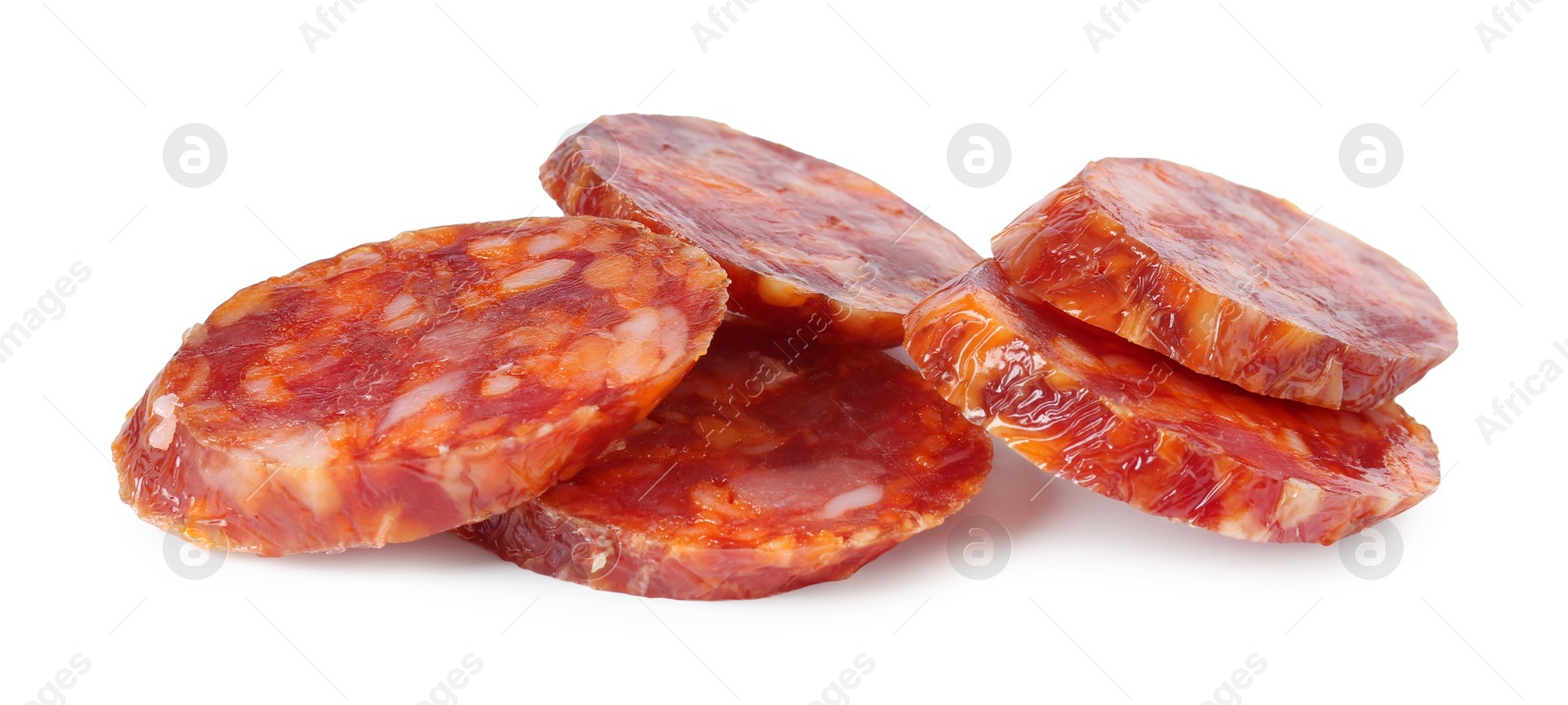 Photo of Pieces of delicious dry cured sausage isolated on white