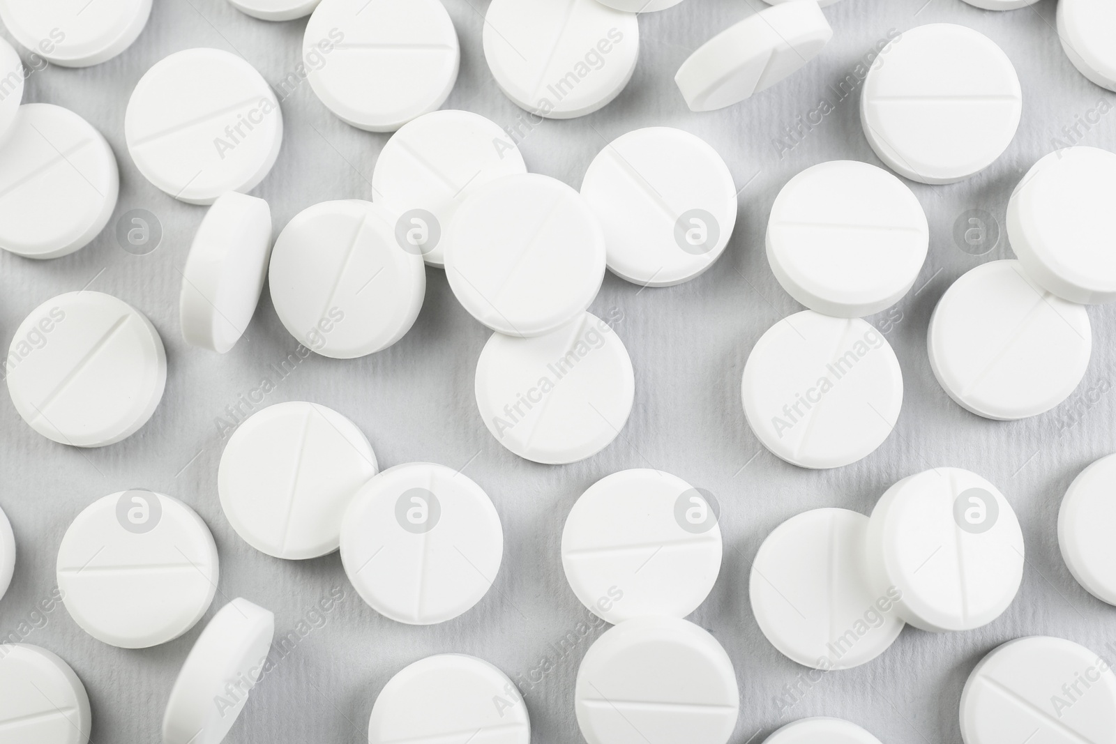 Photo of Many antibiotic pills on grey background, closeup