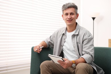 Photo of Portrait of professional psychologist with notebook in office