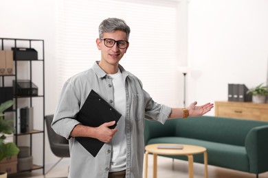 Photo of Portrait of professional psychologist with clipboard in office