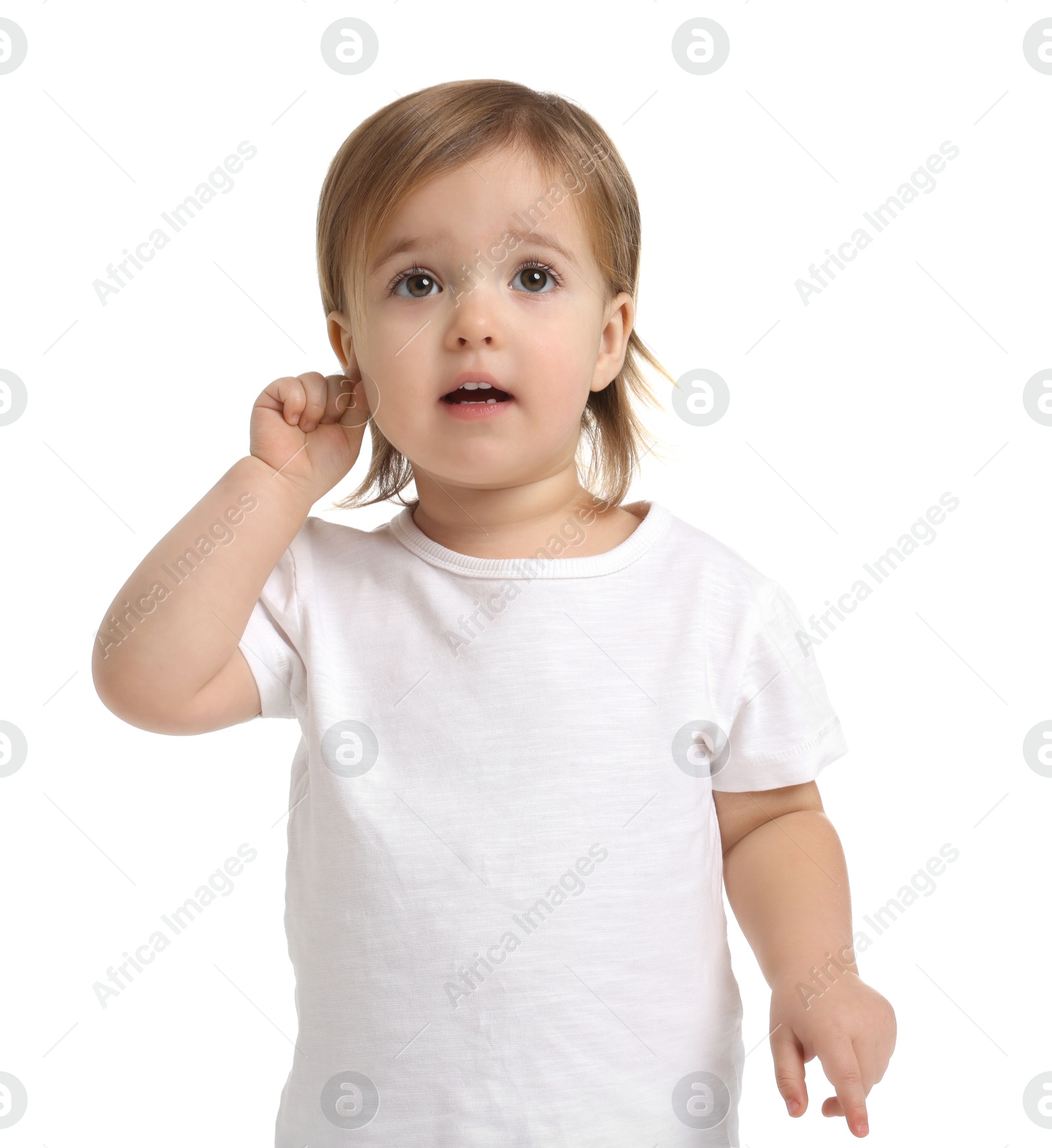 Photo of Cute little baby girl showing her ear on white background