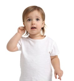 Photo of Cute little baby girl showing her ear on white background