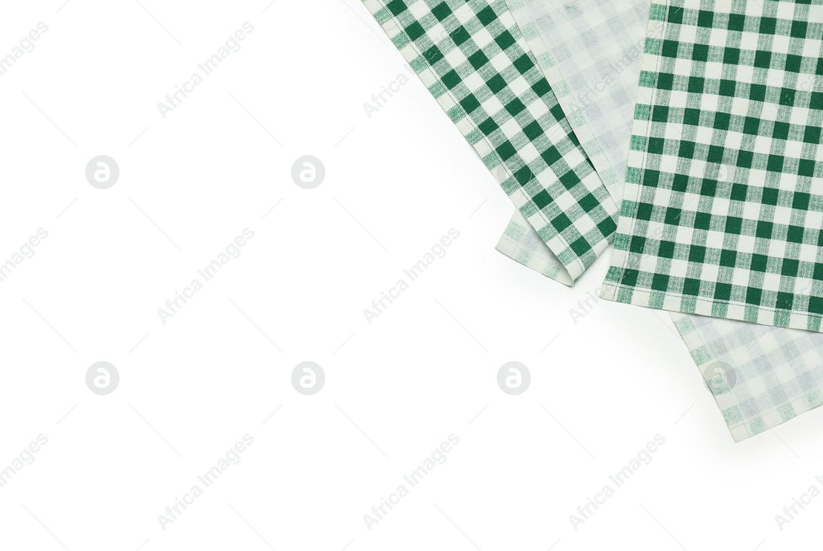 Photo of Green checkered tablecloth isolated on white, top view