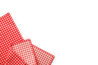 Photo of Red checkered tablecloth isolated on white, top view