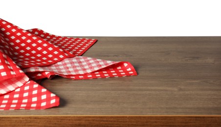 Photo of Red checkered tablecloth on wooden table against white background, closeup