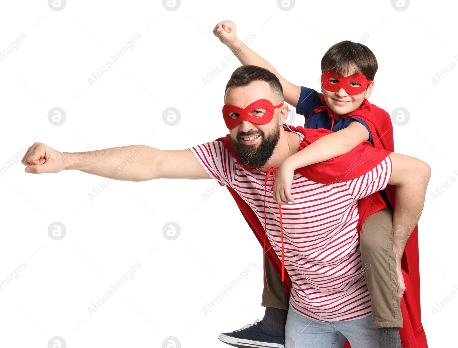 Photo of Father and his son wearing superhero costumes on white background