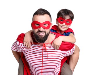 Photo of Father and his son wearing superhero costumes on white background