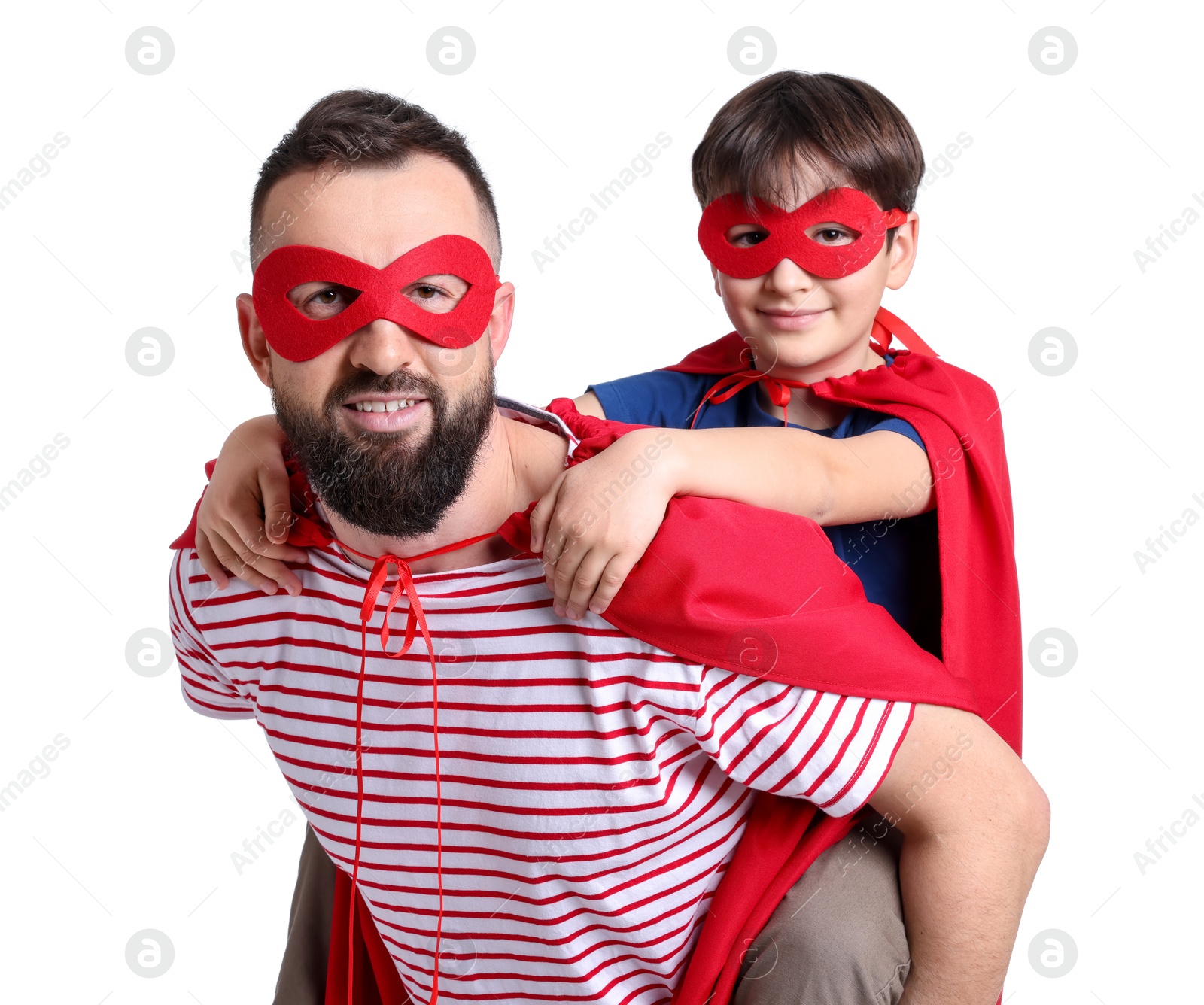 Photo of Father and his son wearing superhero costumes on white background