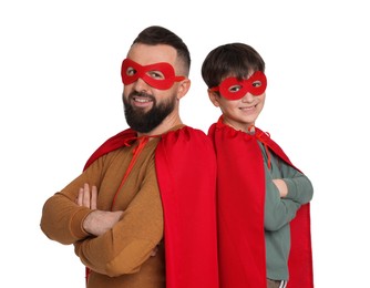 Photo of Father and his son wearing superhero costumes on white background