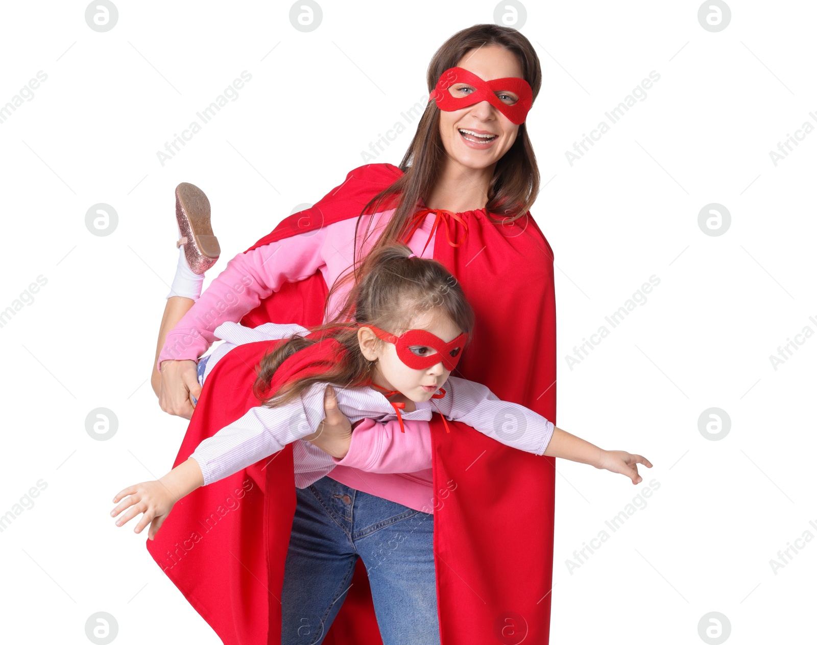 Photo of Mother and her cute little daughter wearing superhero costumes on white background