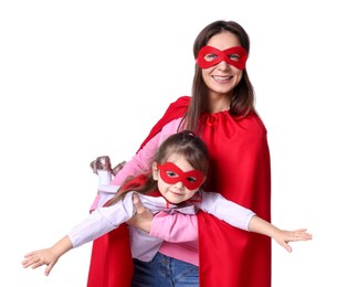 Photo of Mother and her cute little daughter wearing superhero costumes on white background